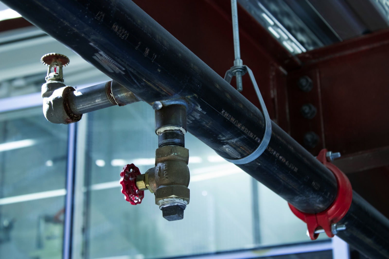 Industrial pipes connected to building for Epo-Weld™ HSS high strength structural epoxy pump casing and chute repair