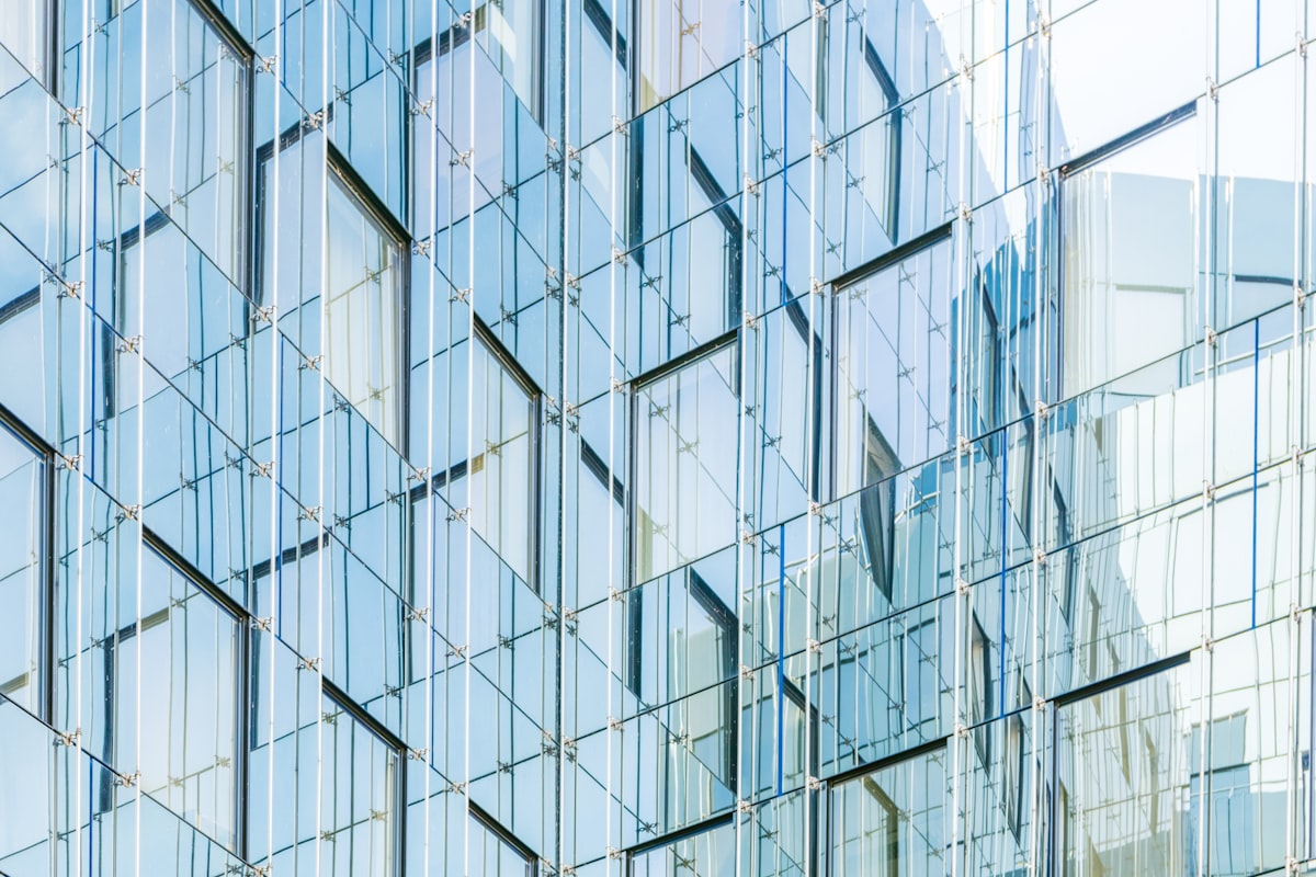 Modern architectural glass facade panel grid for Cast-Max™ glass-to-metal structural assembly and bonding